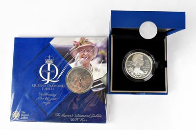 Lot 989 - THE ROYAL MINT; two coins to include a cased...