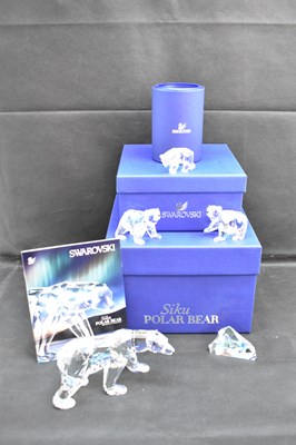 Lot 244 - SWAROVSKI; three polar bear crystal ornaments...