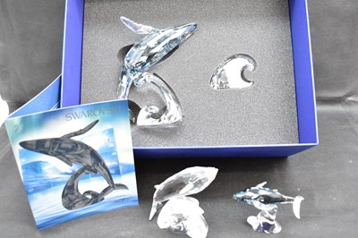 Lot 247 - SWAROVSKI; three whale crystal ornaments...