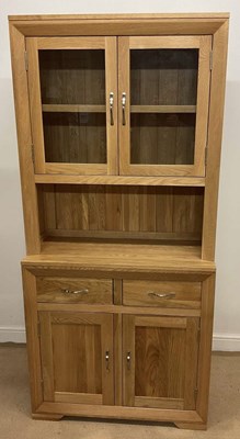 Lot 804 - OAK FURNITURE LAND; a light oak cabinet, the...