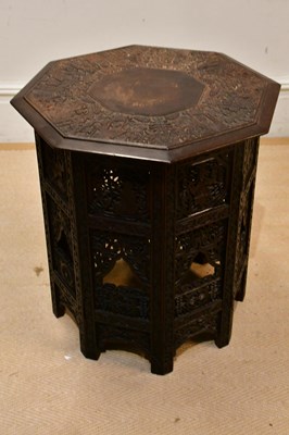 Lot 68 - An Eastern carved octagonal folding table,...