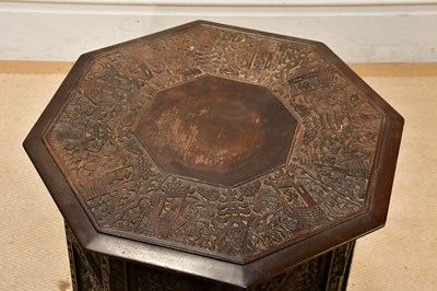 Lot 68 - An Eastern carved octagonal folding table,...
