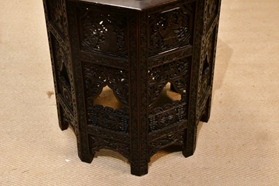 Lot 68 - An Eastern carved octagonal folding table,...