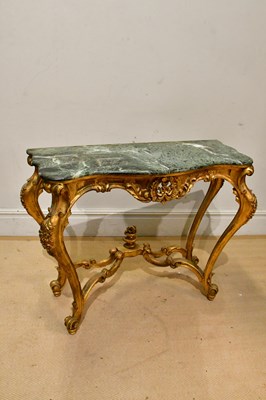 Lot 38 - A gilt wood serpentine fronted marble top...