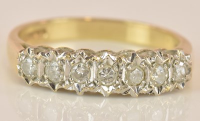 Lot 594 - A 9ct yellow gold seven stone diamond ring...