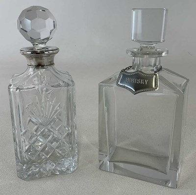 Lot 239 - A cut glass decanter with silver collar,...