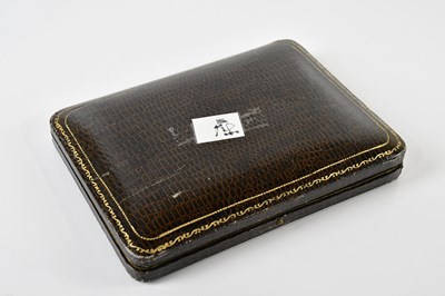 Lot 1200 - A 9ct yellow gold cigarette case of rounded...