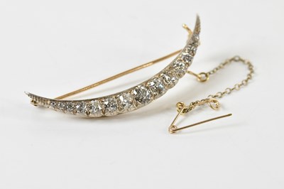 Lot 1234 - An Edwardian diamond set crescent brooch, with...