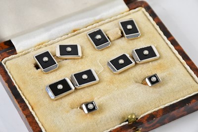 Lot 1211 - A cased set of onyx and seed pearl mounted...