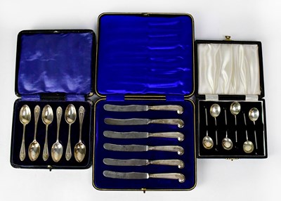 Lot 922 - Three cased sets of hallmarked silver flatware,...