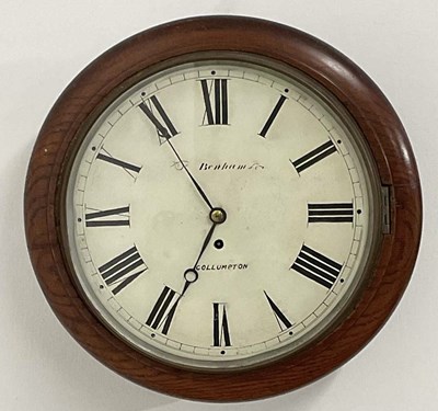 Lot 670 - A 19th century oak circular wall clock, with...