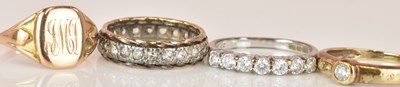 Lot 572 - Four 9ct yellow gold dress rings, combined...