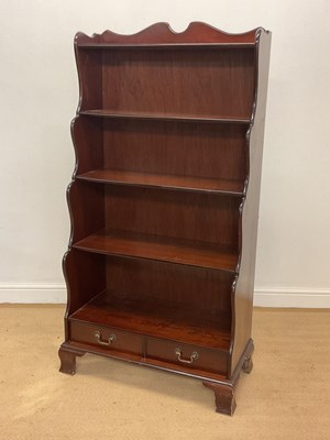 Lot 870 - A reproduction mahogany waterfall bookcase...