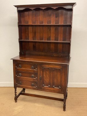 Lot 855 - A late 19th century oak dresser with three...