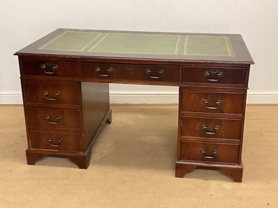 Lot 871 - A reproduction mahogany leather topped desk...