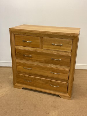 Lot 858 - OAK FURNITURE LAND; an oak chest of two short...