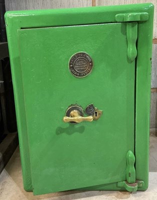 Lot 139 - PHILLIPS & SON; a safe, with brass handle and...