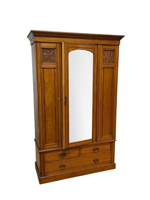 Lot 246 - A late Victorian wardrobe, the moulded cornice...