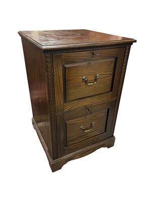 Lot 84 - A modern dark oak two drawer filing cabinet,...