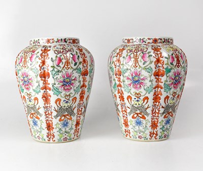 Lot 211 - A pair of lobed Canton vases, decorated with...