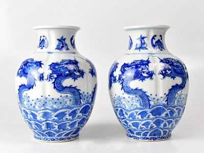 Lot 227 - A pair of blue and white lobed vases, each...