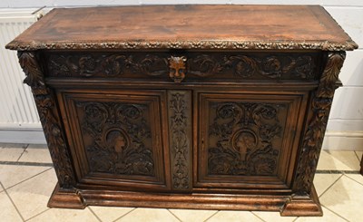 Lot 34 - A Victorian carved oak sideboard with one long...