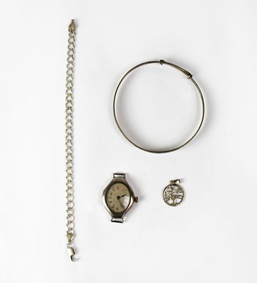 Lot 1108 - A silver ladies' wristwatch, the silvered dial...