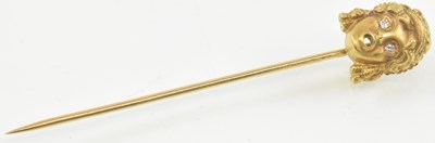 Lot 899 - An 18ct yellow gold hat pin, the top...