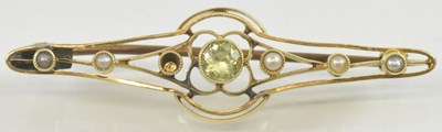 Lot 864 - A 15ct yellow gold peridot and seed pearl set...