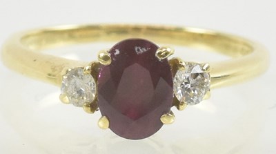 Lot 810 - An 18ct yellow gold ruby and diamond set ring,...