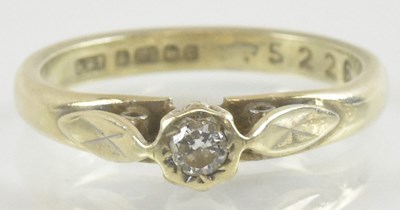 Lot 889 - A 9ct yellow gold diamond set solitaire ring,...