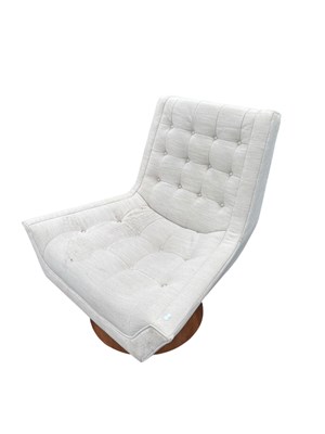 Lot 29 - A contemporary swivel lounge chair upholstered...