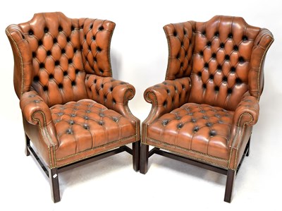 Lot 58 - A pair of brown leather Chesterfield wingback...