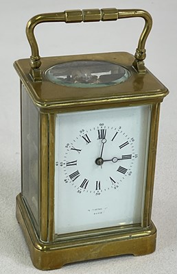 Lot 674 - A circa 1900 brass carriage clock, with swing...