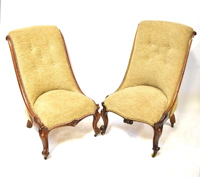 Lot 60 - A pair of walnut framed slipper chairs,...