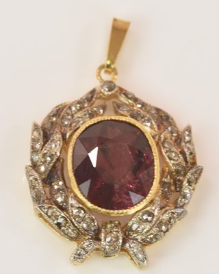 Lot 575 - A yellow metal diamond and garnet pendant, the...