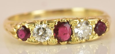 Lot 515 - An 18ct yellow gold ruby and diamond five...