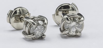 Lot 506 - A pair of diamond ear studs, the twin round...