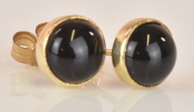 Lot 602 - A pair of 9ct yellow gold cabochon set ear...