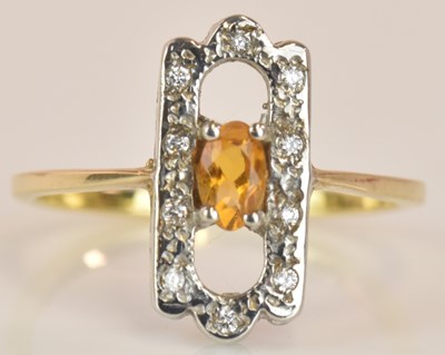 Lot 551 - A yellow metal diamond and citrine ring in the...