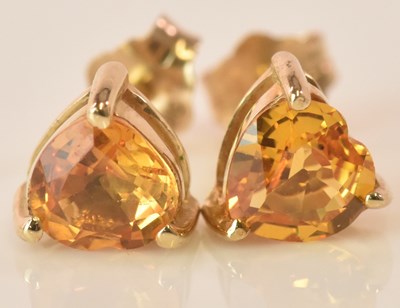 Lot 526 - A pair of 9ct yellow sapphire heart shaped ear...