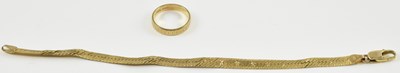 Lot 880 - A 9ct yellow gold wedding band, size K/L, and...