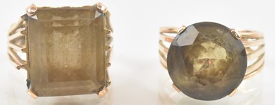 Lot 830 - A yellow metal topaz set ring, the square cut...