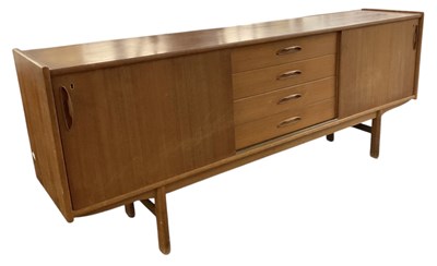 Lot 1 - A teak mid century sideboard, with pair of...