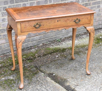 Lot 65 - A 1930s burr walnut single drawer writing...