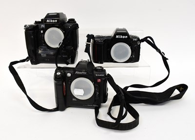 Lot 453 - A collection of SLR camera bodies comprising a...