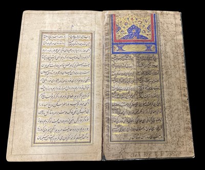 Lot 1008 - An ancient Persian Qajar leather bound...