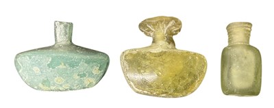 Lot 690 - Two Roman style glass perfume bottles, one...