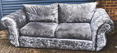 Lot 63 - A grey velvet two seater settee with scrolling...