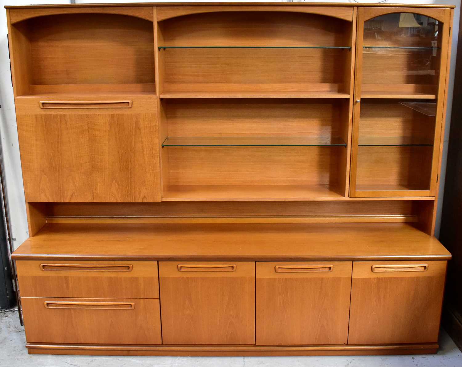 Lot 14 - MEREDEW; a teak dresser, the top with cocktail...